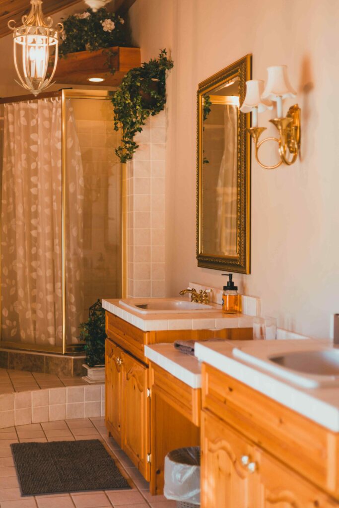 17 Cozy Bathroom Ideas to Create a Warm and Relaxing Retreat 13 Cozy farmhouse bathroom with warm wood finishes, vintage charm, and a welcoming rustic atmosphere.