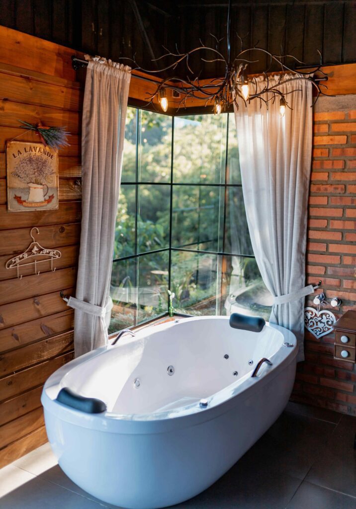 17 Cozy Bathroom Ideas to Create a Warm and Relaxing Retreat 5 Rustic cabin bathroom with natural wood textures, cozy lighting, and a relaxing countryside feel.